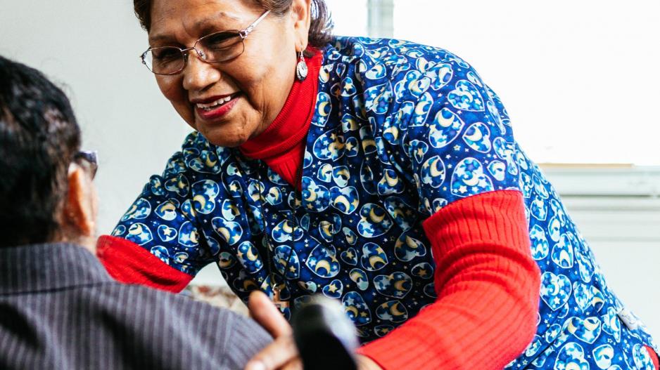 An NDWA member cares for an older adult at home.